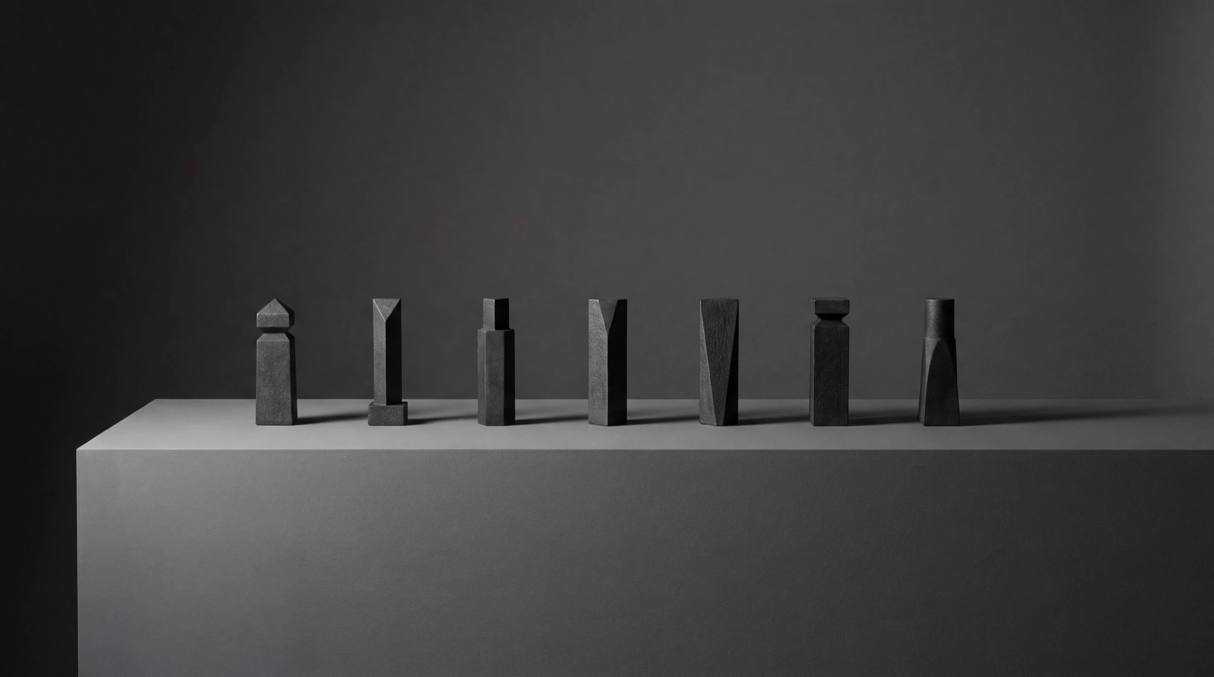 Seven markers in a row on one surface: the sequence as a physical object, read left to right.